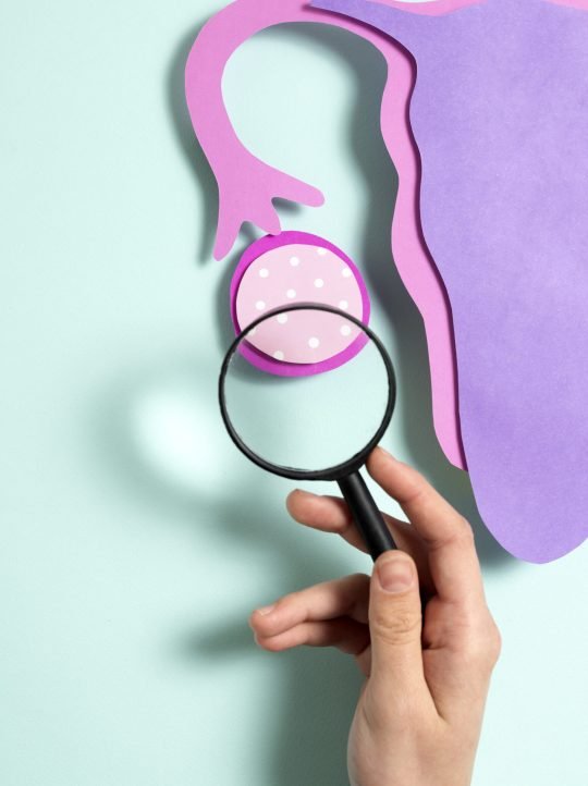 top-view-hand-holding-magnifying-glass